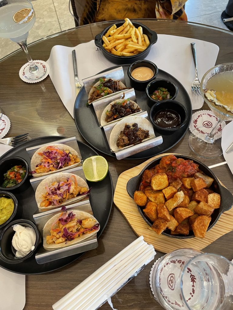 The prawn soft shell tacos, barbecue beef tacos and sausage skillet at Brisk Lagos.