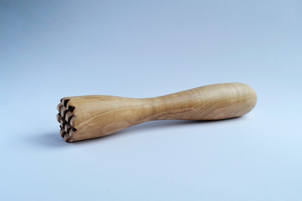 A wooden muddler