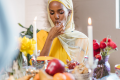 a muslim woman eating halal food