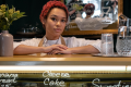 A woman behind a food counter